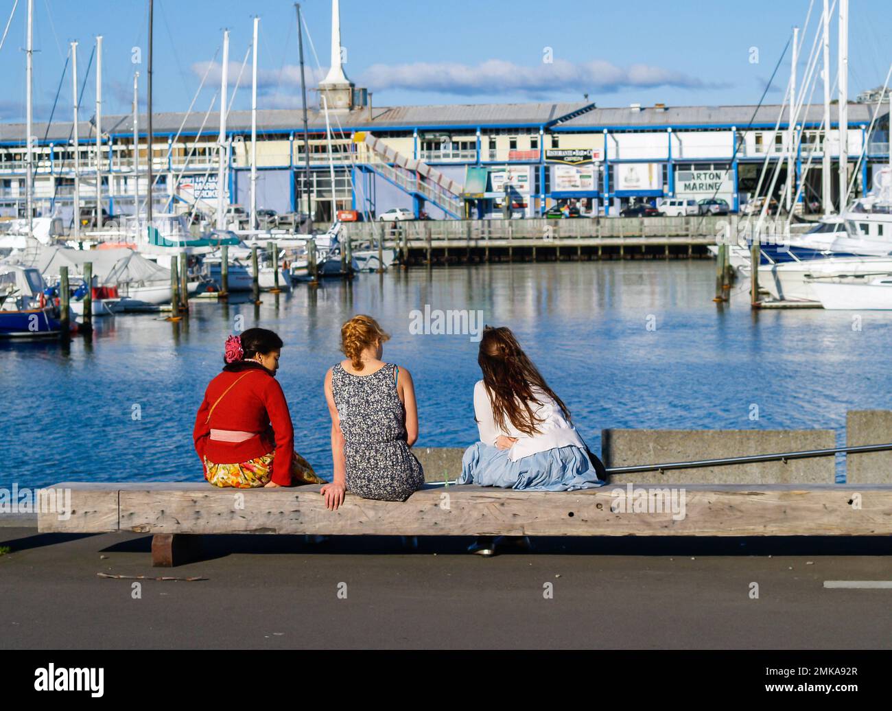 Wellington New Zealand - October 2 2010; Three young people one Wellington waterfront. Stock Photo