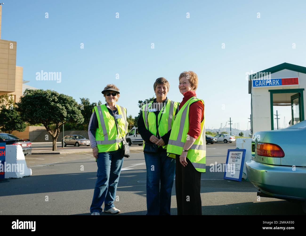 Wellington New Zealand - October 4 2010; Three women volunteer car parking attendants at Harbourside Farmers Market. Stock Photo