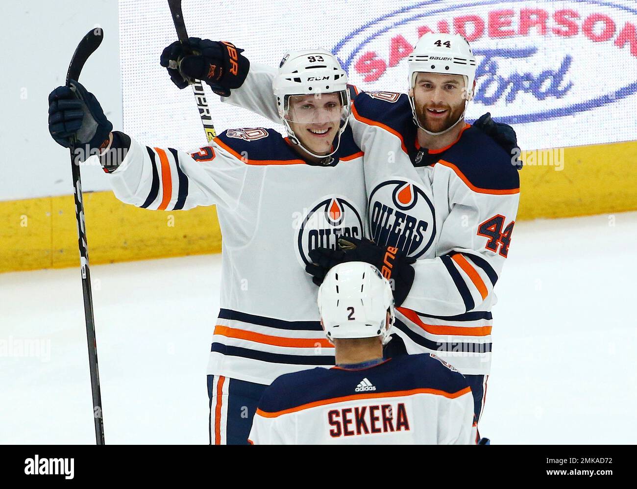 Edmonton Oilers defenseman Matt Benning (83) celebrates his goal against  the Arizona Coyotes with Oilers defenseman Andrej Sekera (2) and right wing  Zack Kassian (44) during the second period of an NHL