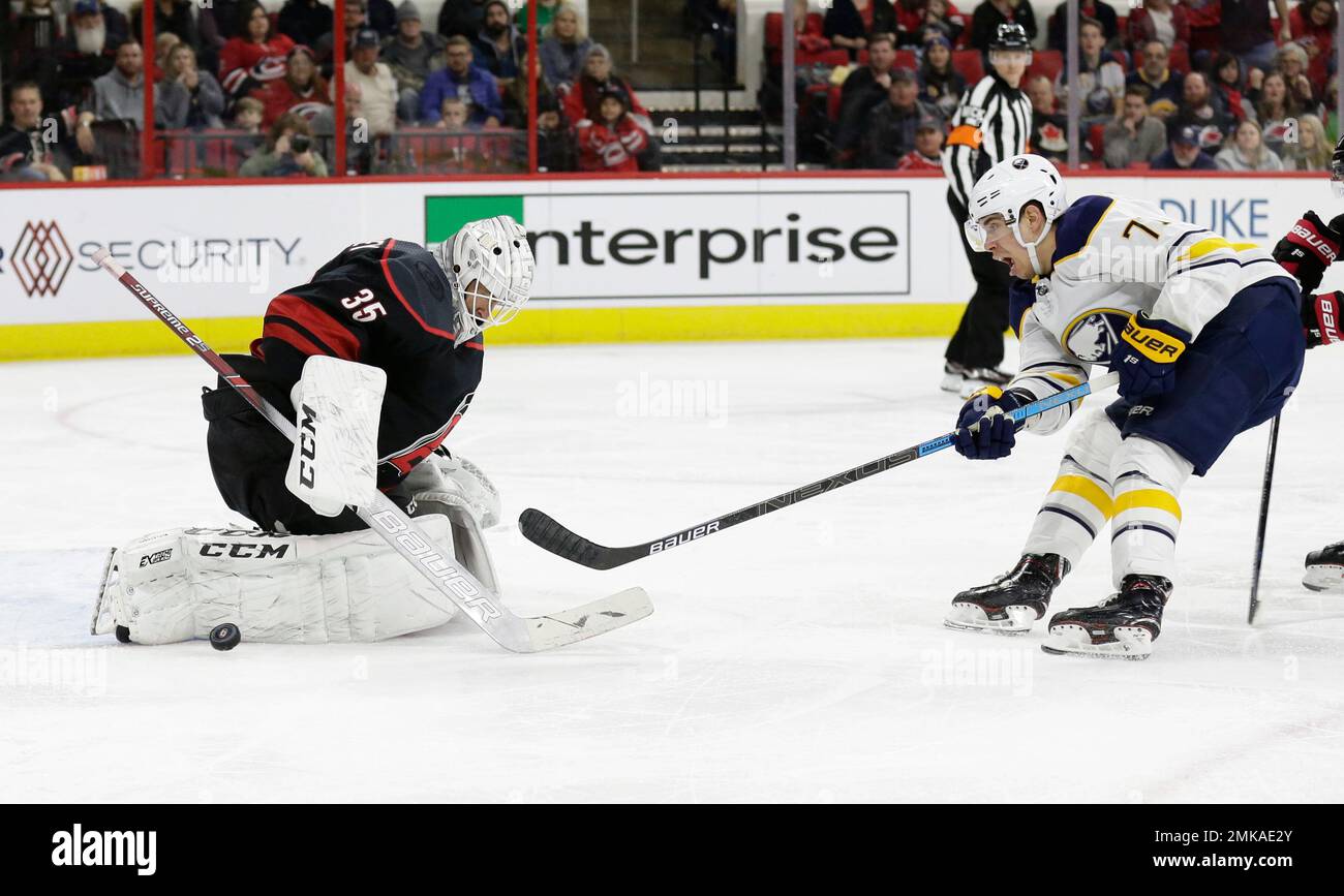 Carolina Hurricanes goalie Curtis McElhinney (35) blocks Buffalo Sabres