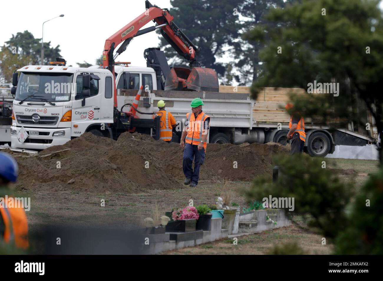 Workers dig graves at a Muslim cemetery in Christchurch, New Zealand