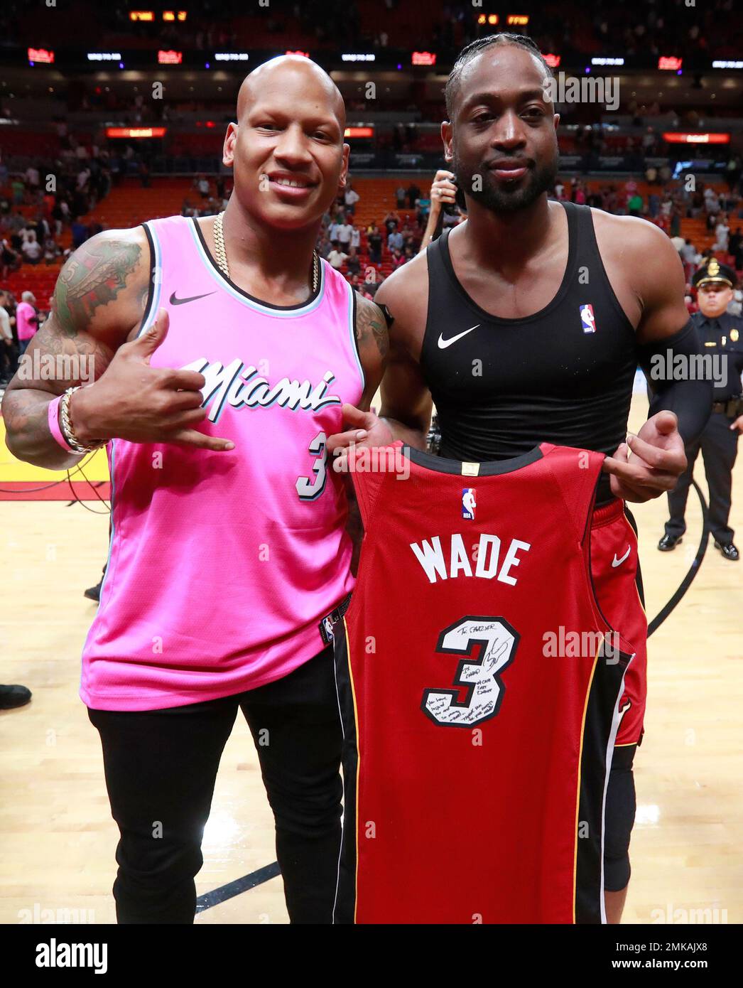 Miami Heat guard Dwyane Wade, right, poses with Pittsburgh Steelers  linebacker Ryan Shazier after an NBA basketball game Friday, March 15,  2019, in Miami. Wade gave his game jersey to Shazier. The