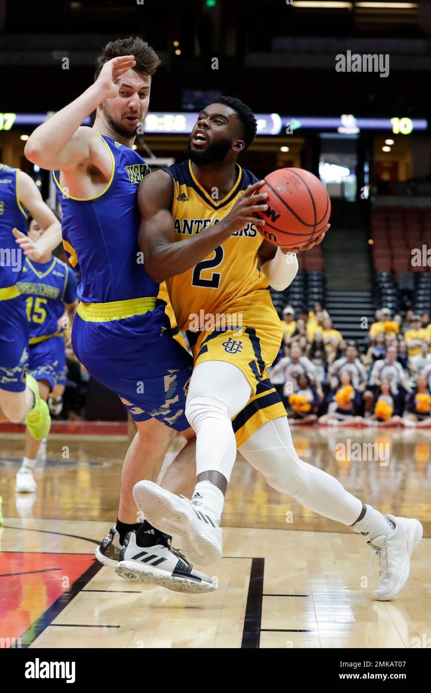 UC Irvine guard Max Hazzard, right, drives around UC Riverside guard