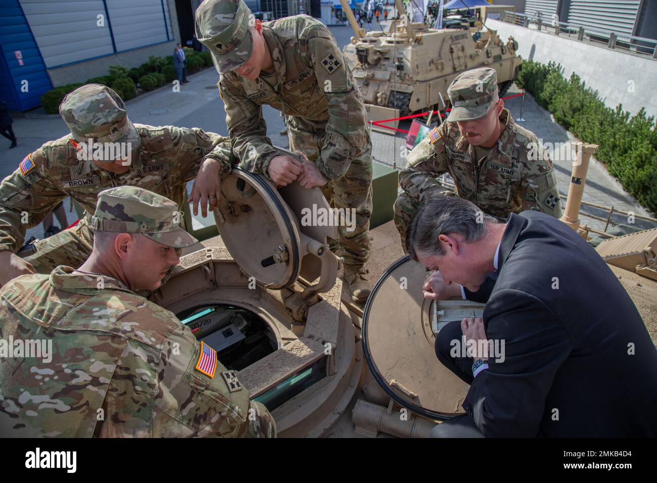 The Honorable Doulgas Bush, U.S. assistant secretary of the Army for acquisition, logistics, and technology, looks inside of a U.S. Army M1A2 Abrams battle tank with the tanks armor crewman, assigned to Bravo Company, 1st Battalion, 68 Armored Regiment, 3rd Armored Brigade Combat Team, 4th Infantry Division, during the 30th annual International Defense Industry Exhibition at Kielce, Poland, Sept. 7, 2022. Trade shows like MPSO provide a unique opportunity for the U.S. Department of Defense and defense industry to engage with Allies and partners, and demonstrate some of its capabilities. Stock Photo