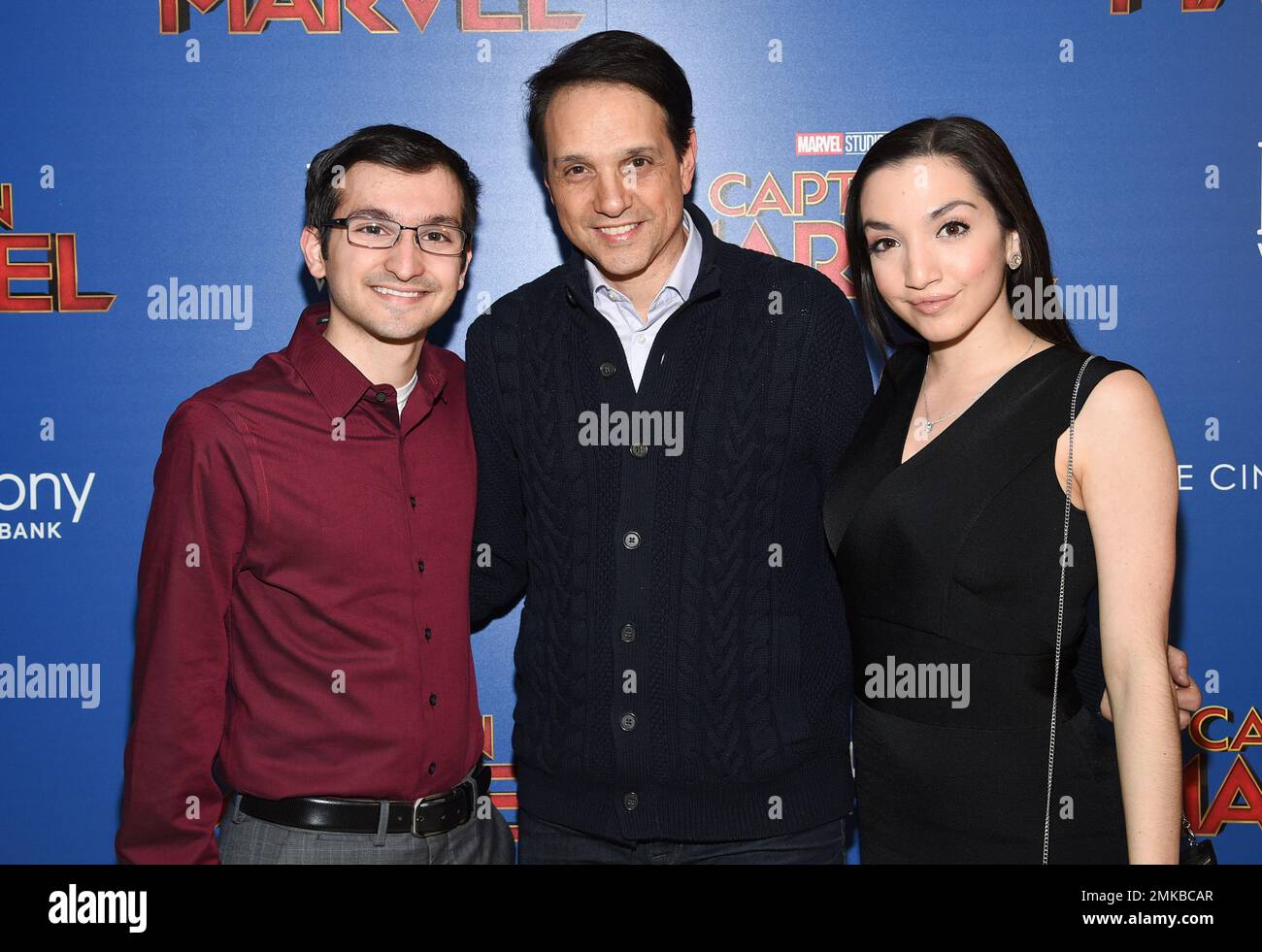 Actor Ralph Macchio, center, poses with his children Daniel Macchio and  Julia Macchio at a special screening of \, image size:1300x981
