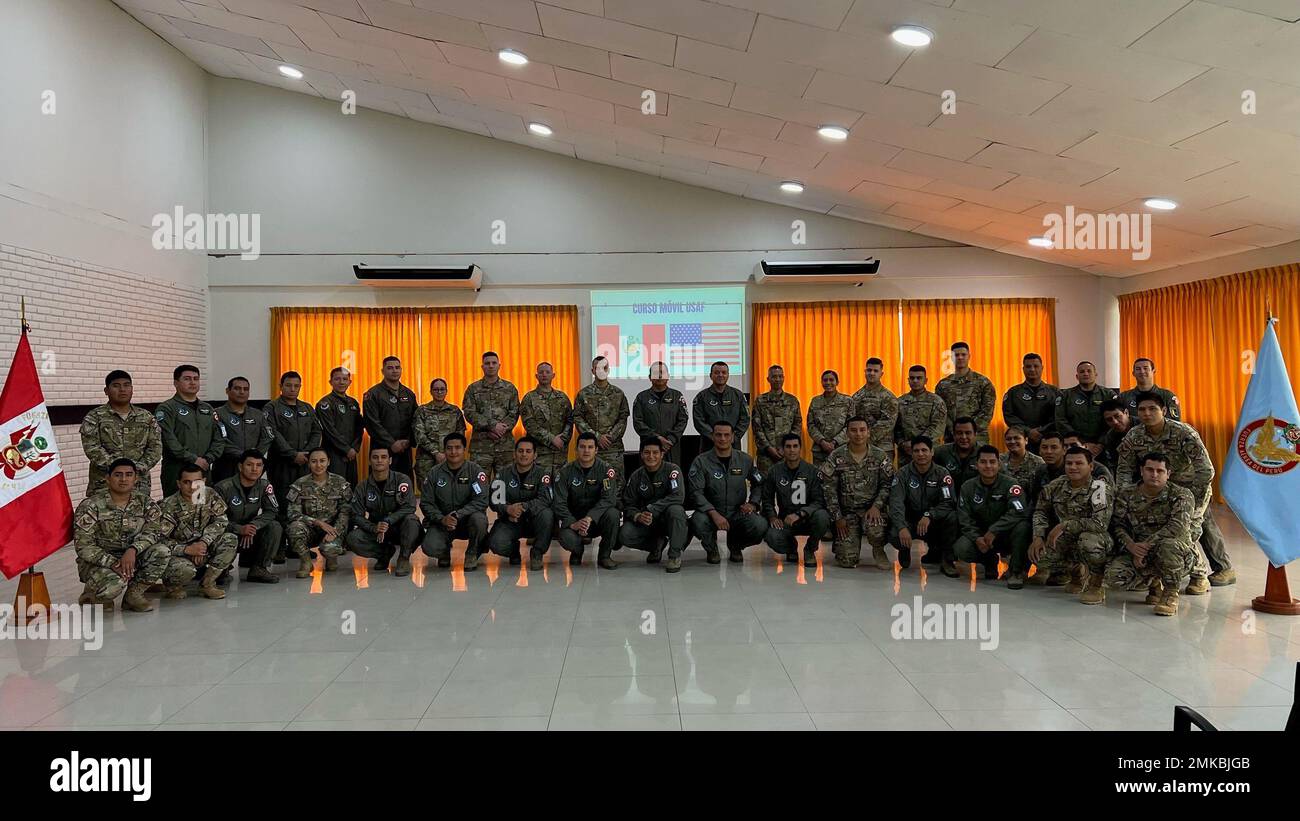 U.S Air Force’s 571st Mobility Support Advisory Squadron (MSAS) advisors gather for a photo with Fuerza Aérea de Peru (FAP)’s Grupo Aéreo N. 42 service members, Sept. 7, 2022, in Base Area Coronel Francisco Secada Vignetta Air Base, Peru. During the 20-day training engagement, MSAS air advisors trained FAP service members, officer and enlisted, on aerial port operations, cargo load planning, supply and aircraft maintenance through classroom instruction, hands-on training and multiple exercises in order to improve the FAP’s capabilities for real-world situations and global exercises. Stock Photo