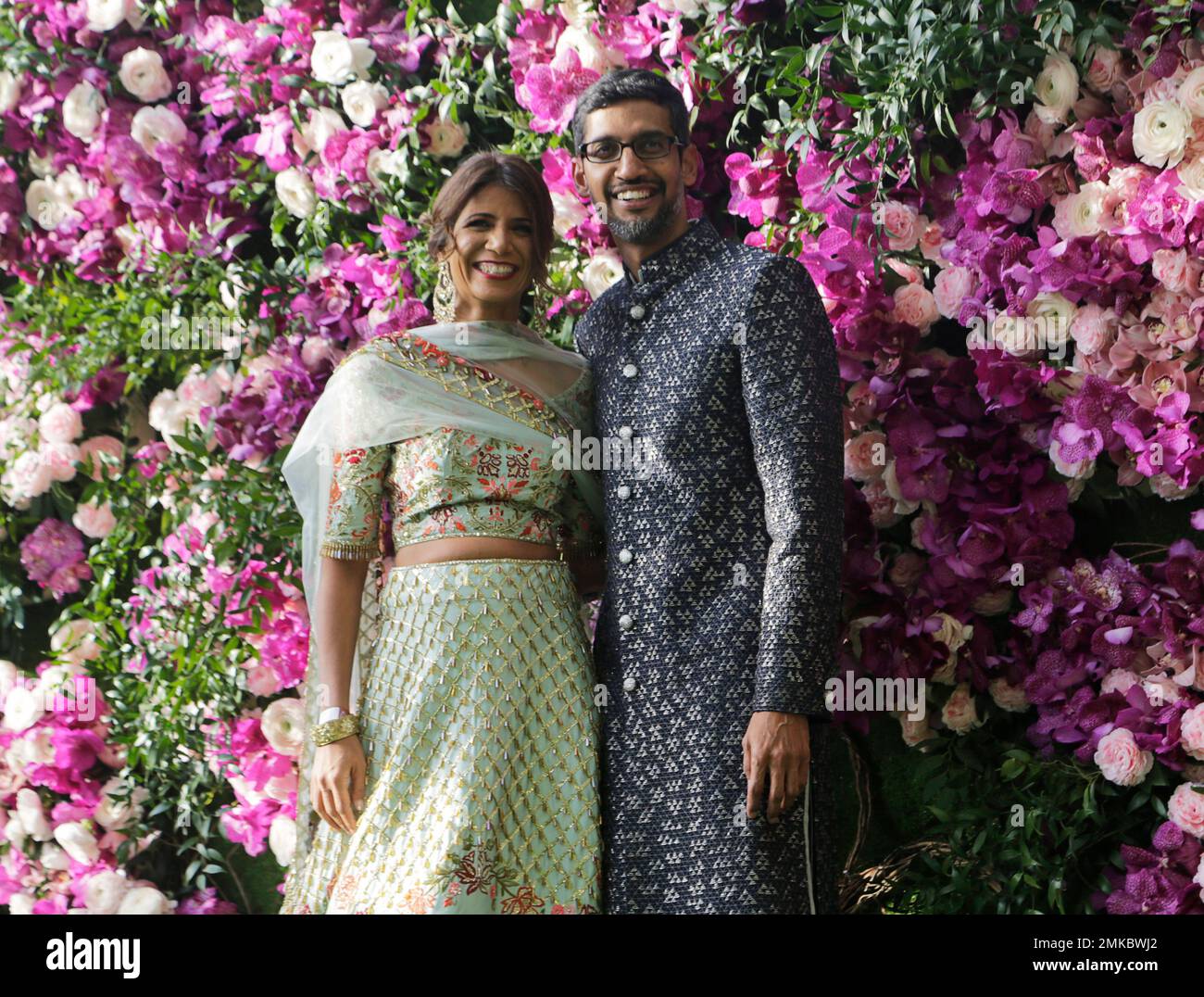 Google CEO Sundar Pichai and his wife Anjali Pichai stand for