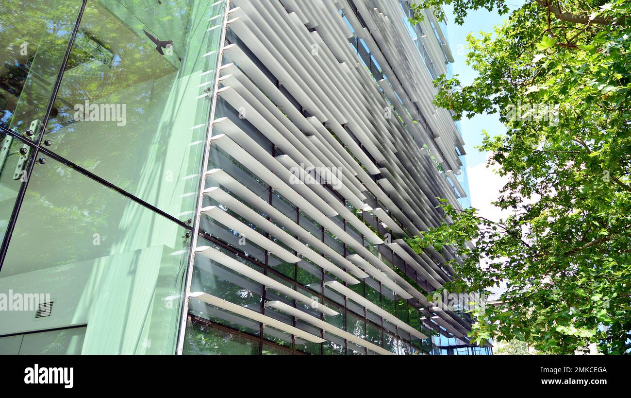Abstract closeup of the glass-clad facade of a modern building covered ...