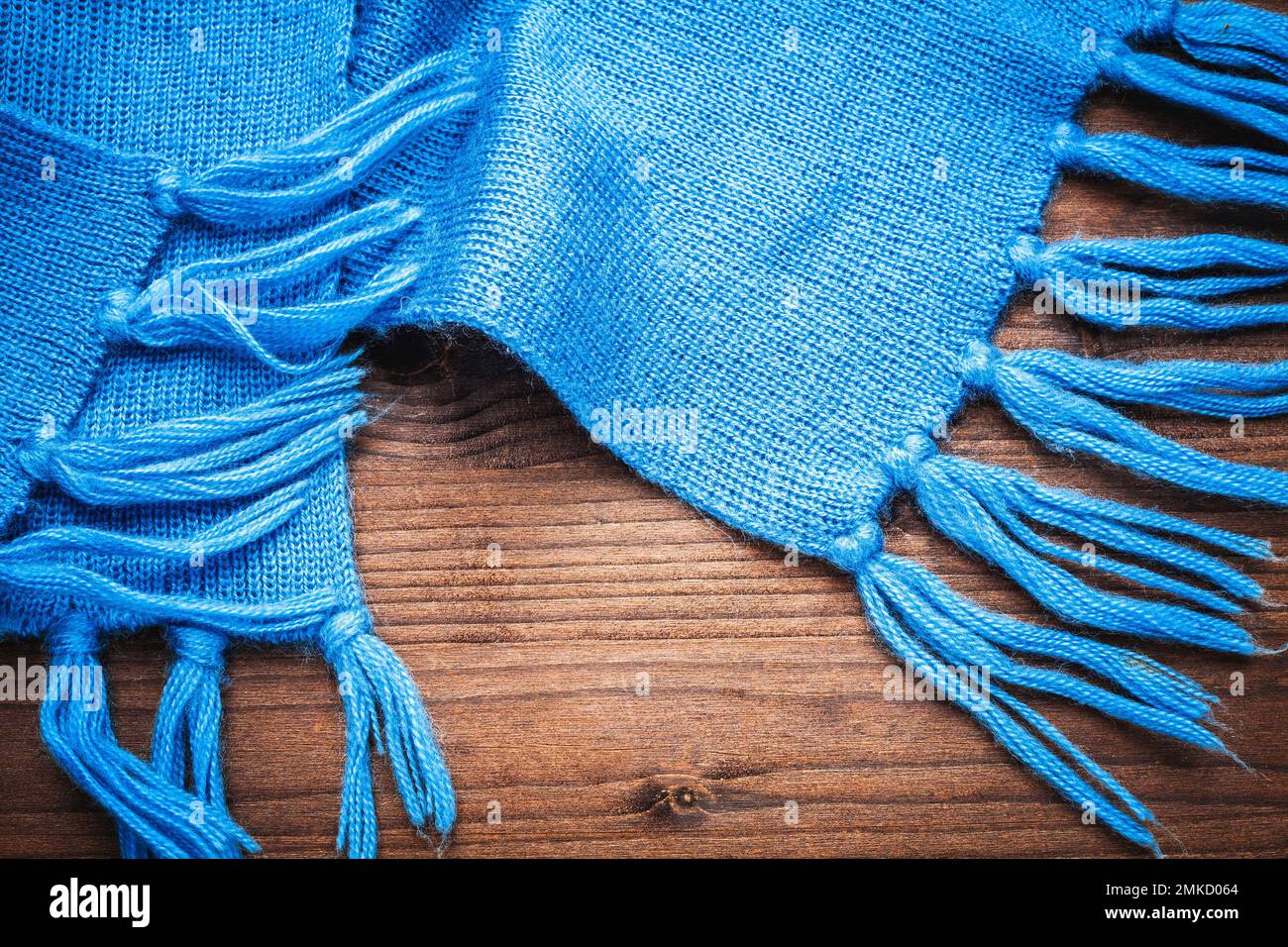 Sky blue winter warm scarf on wood Stock Photo