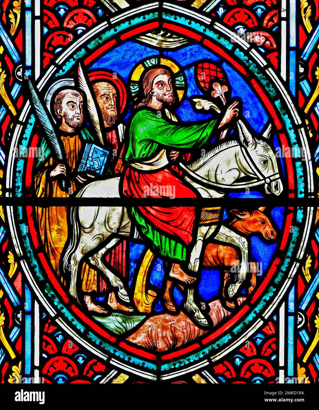 Jesus Christ rides into Jerusalem on a donkey, with two disciples, Palm Sunday, Passion Window by Adolph Didron, 1860, stained glass, Feltwell church, Stock Photo