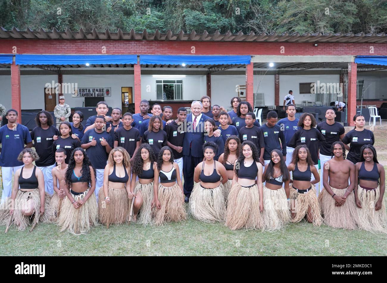 U.S. Secretary of the Navy Carlos Del Toro, poses for a photograph with the teenagers of the Brazilian Forcas no Esporte (Forces in Sport) program following their Brazilian jiu-jitsu inspired dance demonstration on the official opening day of exercise UNITAS LXIII at Ilha do Governador, Rio de Janeiro, Sept. 8, 2022. The Brazilian Forcas no Esporte program aims to reduce social risks of vulnerable young Brazilians, strengthen bonds of citizenship, inclusion, and social integration. The SECNAV toured the training location to visit with the host nation Brazilians as well as Marines from twelve p Stock Photo
