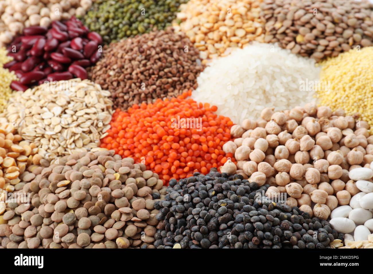 Different types of legumes and cereals as background, closeup. Organic