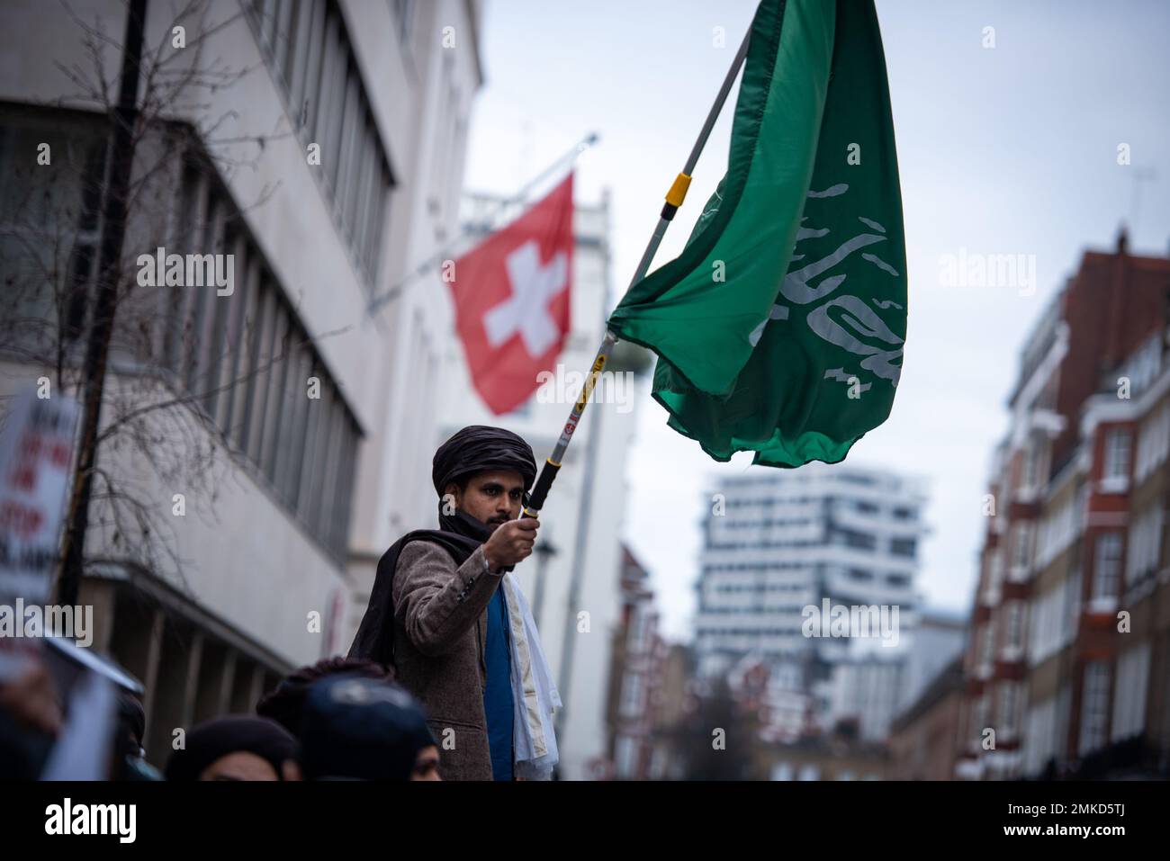 London, UK. 28th Jan, 2023. A protestor waves a flag outside the Sweden Embassy of London during the demonstration against the Quran Burning In Sweden The high representative of the United Nations Alliance of Civilizations has condemned the burning of the Muslim holy book by a Swedish-Danish far-right politician as a 'vile act''. Rasmus Paludan, leader of the Danish far-right political party Hard Line, carried out the stunt outside the Turkish embassy in Sweden under the protection of local police on Friday 27 January 2023. (Credit Image: © Loredana Sangiuliano/SOPA Images via Stock Photo