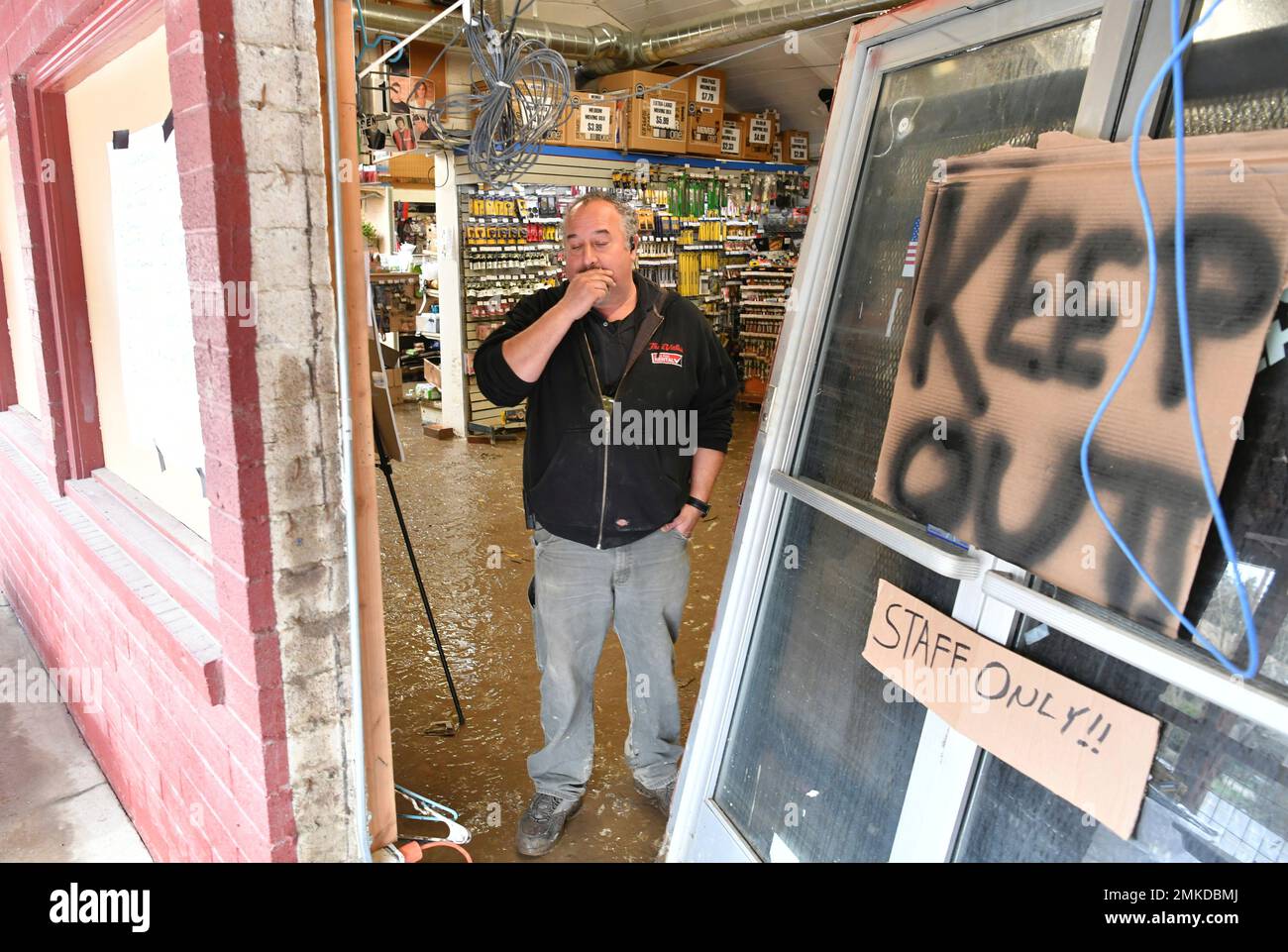 True value hardware store manager chris reid pauses while surveying
