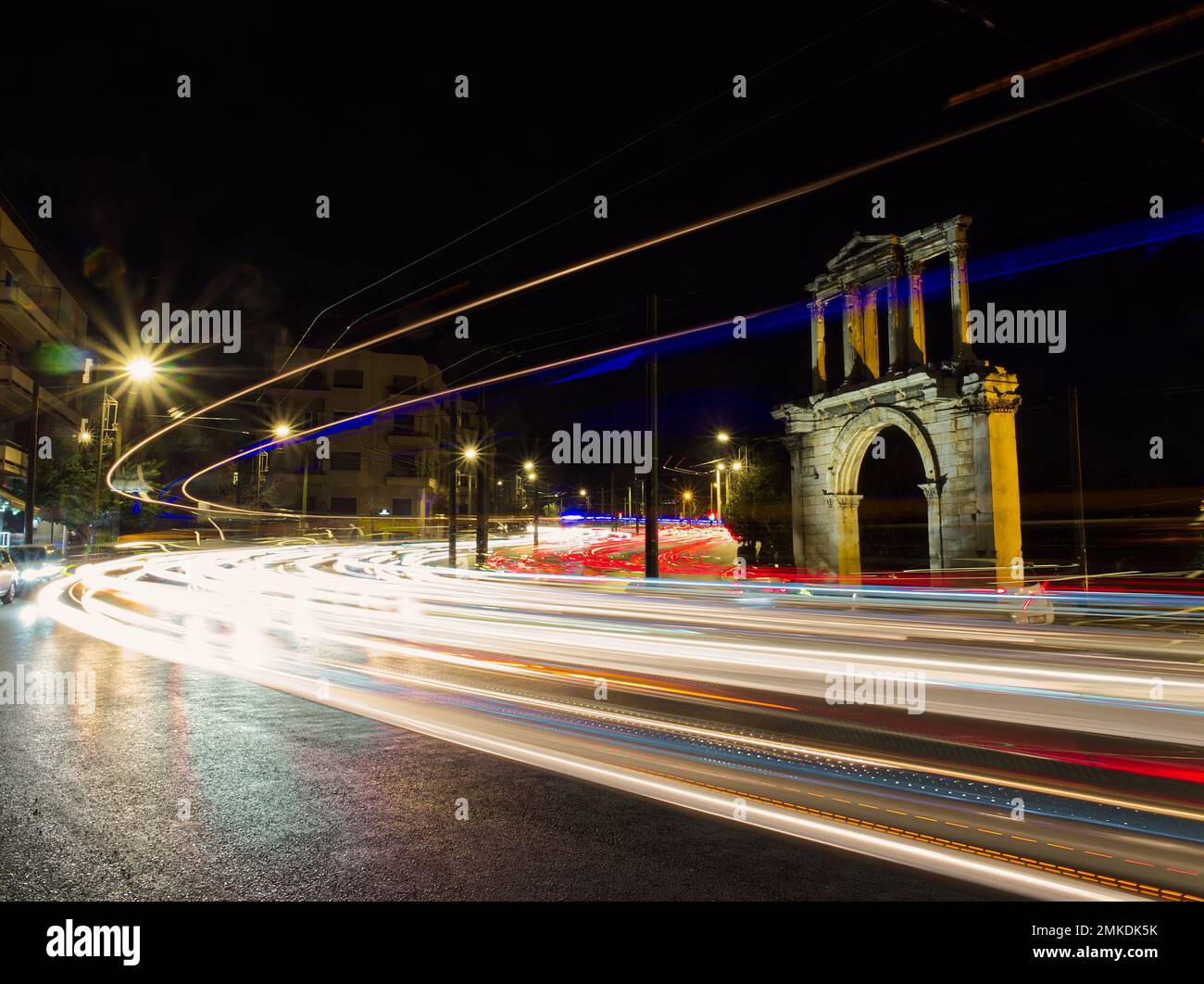 Light trails under Hadrian Arch, Athens, Greece Stock Photo