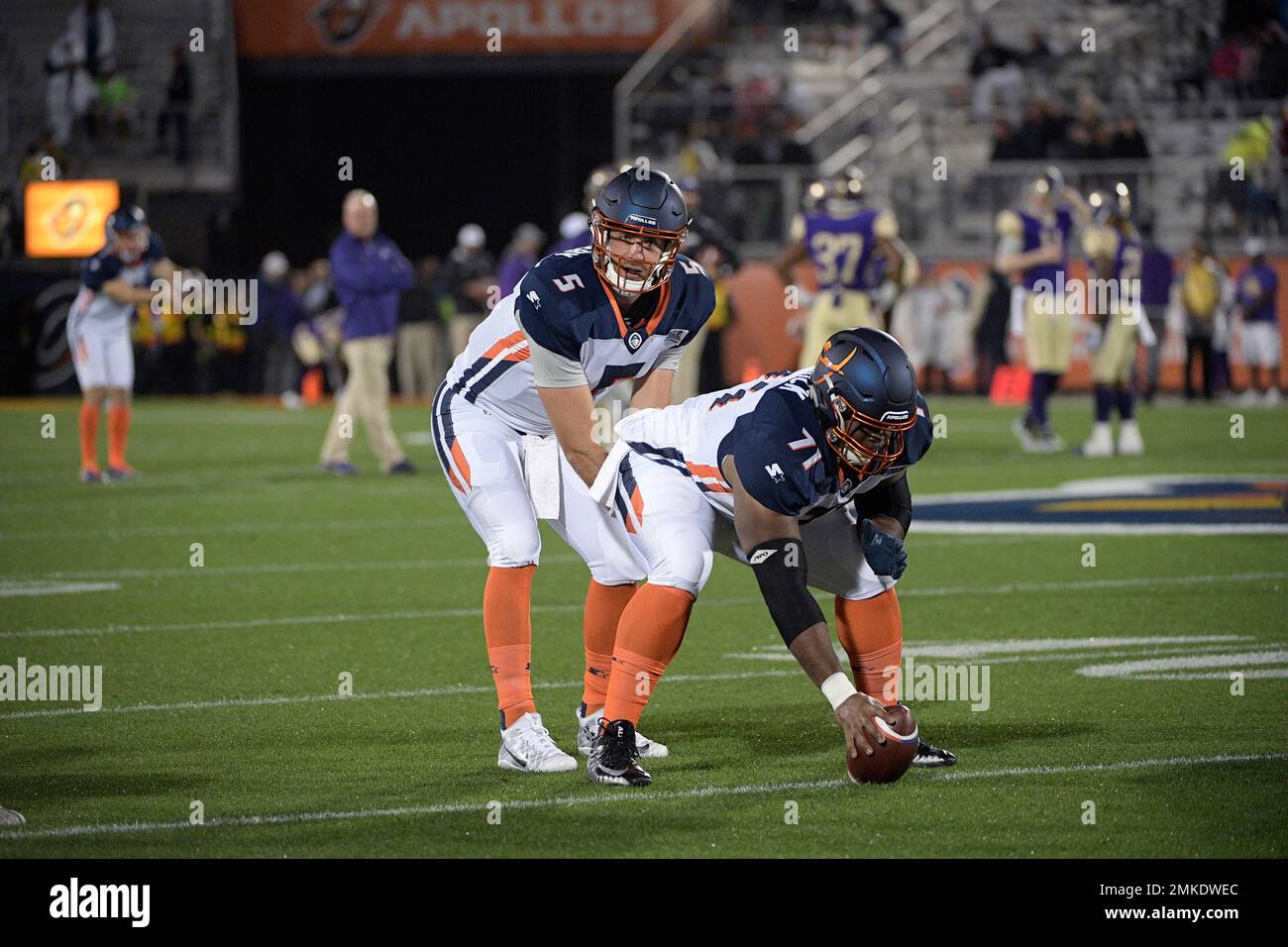 Orlando Apollos quarterback Austin Appleby (5) and offensive lineman Ronald  Patrick (71) warm up before an