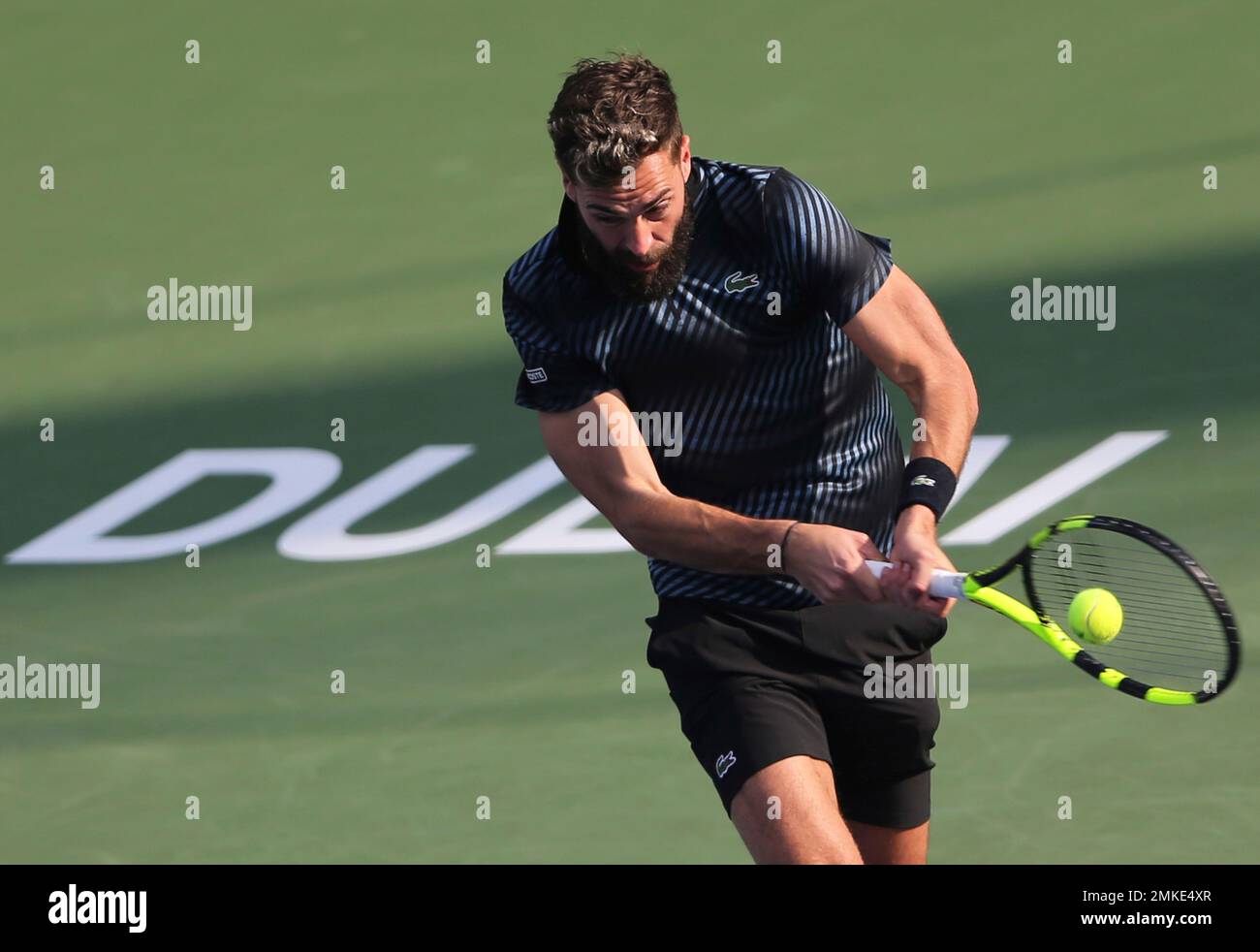 France's Benoit Paire returns the ball to Japan's Kei Nishikori during  their match at the Dubai Duty Free Tennis Championship, in Dubai, United  Arab Emirates, Tuesday, Feb. 26, 2019. (AP Photo/Kamran Jebreili