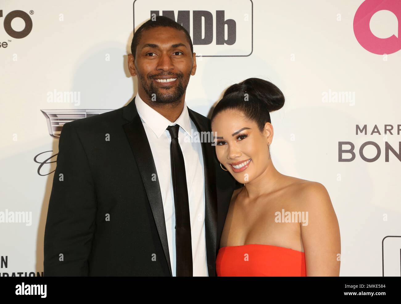 Metta World Peace, left, and Kimsha Artest arrive at the 2019 Elton