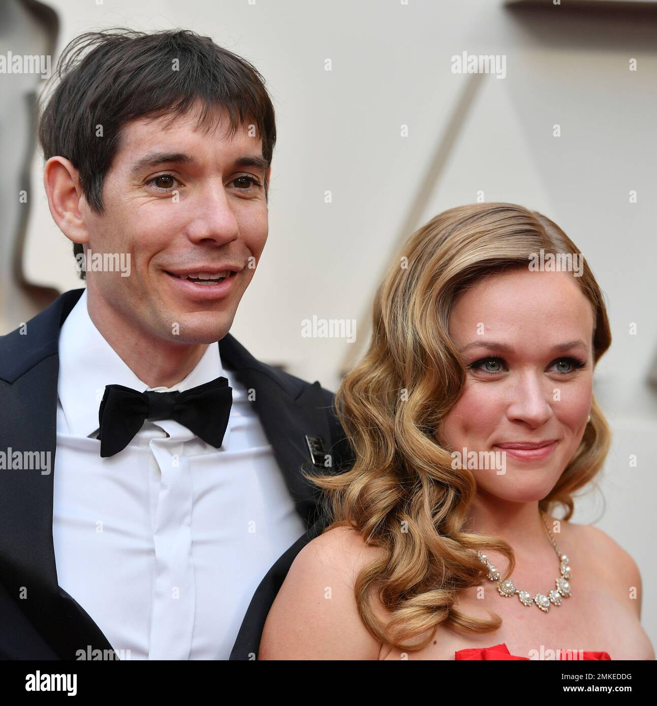 Alex Honnold, left, and Sanni McCandless arrive at the Oscars on Sunday,  Feb. 24, 2019, at the Dolby Theatre in Los Angeles. (Photo by Jordan  Strauss/Invision/AP Stock Photo - Alamy