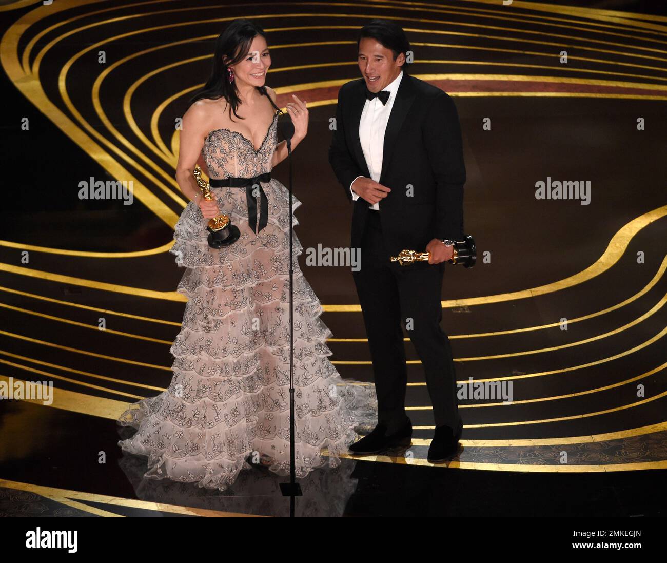 Elizabeth Chai Vasarhelyi left and Jimmy Chin accept the award
