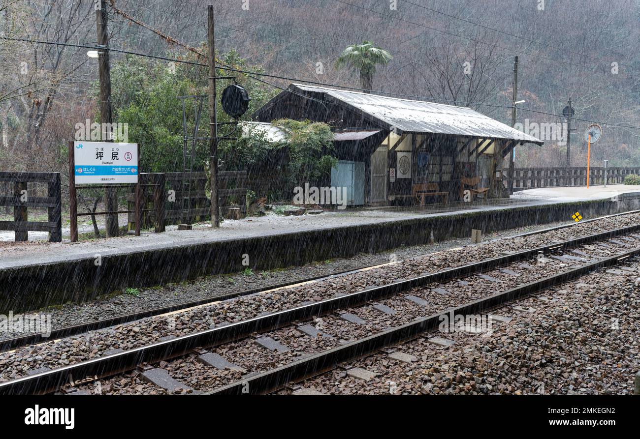The platform, tracks, and shelter building at JR Shikoku Tsubojiri Station in Miyoshi, Tokushima Prefecture, Japan. Stock Photo