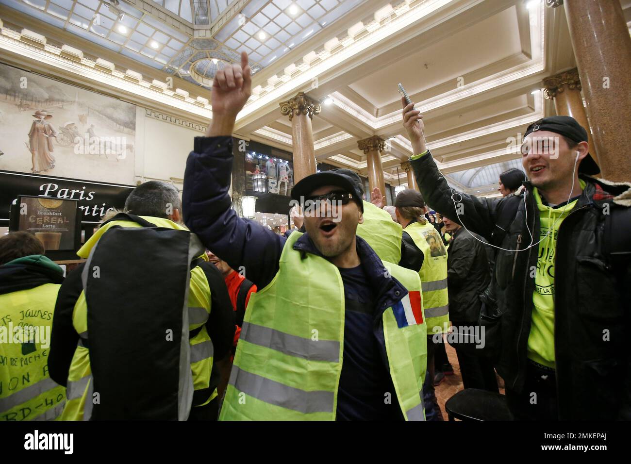 People wearing yellow vests stage a protest against the multinational