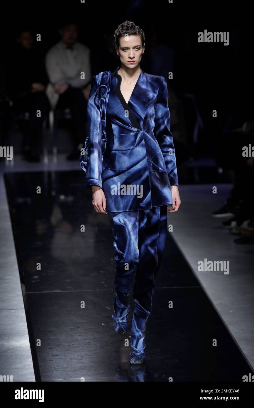A model wears a creation as part of the Giorgio Armani women s