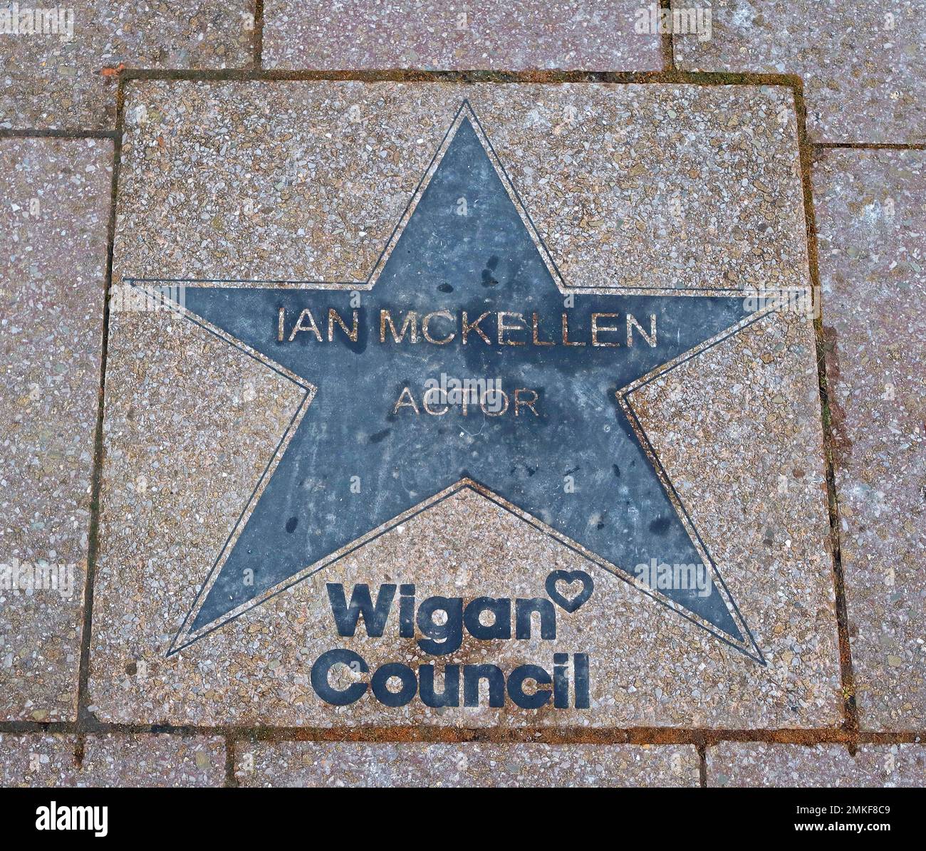 Ian McKellen star on the Wigan Council walk of fame, Believe Square / Life Centre, The Wiend, Wigan town centre Stock Photo