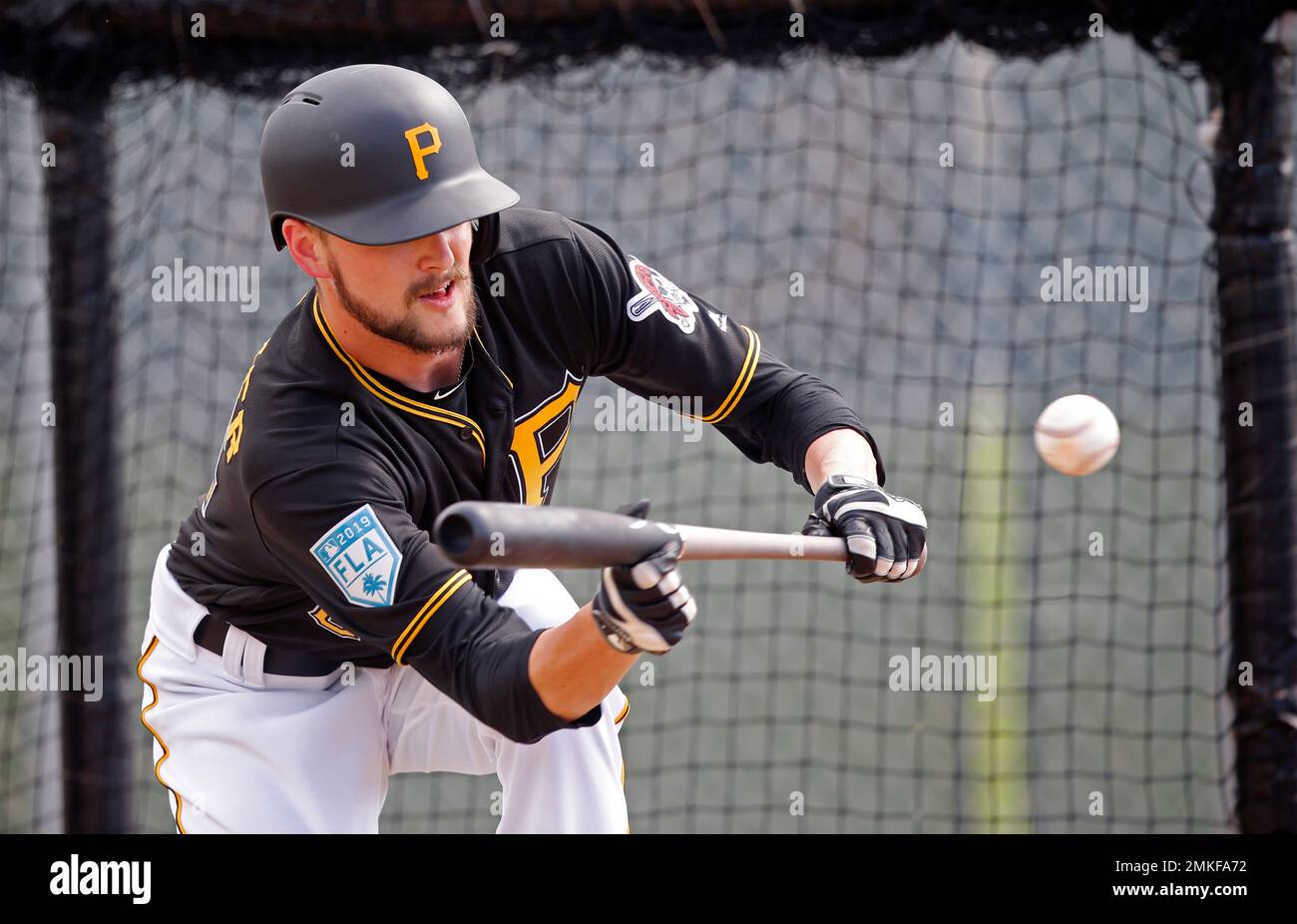 Pittsburgh Pirates JT Brubaker practices bunts in the batting cage at their baseball spring