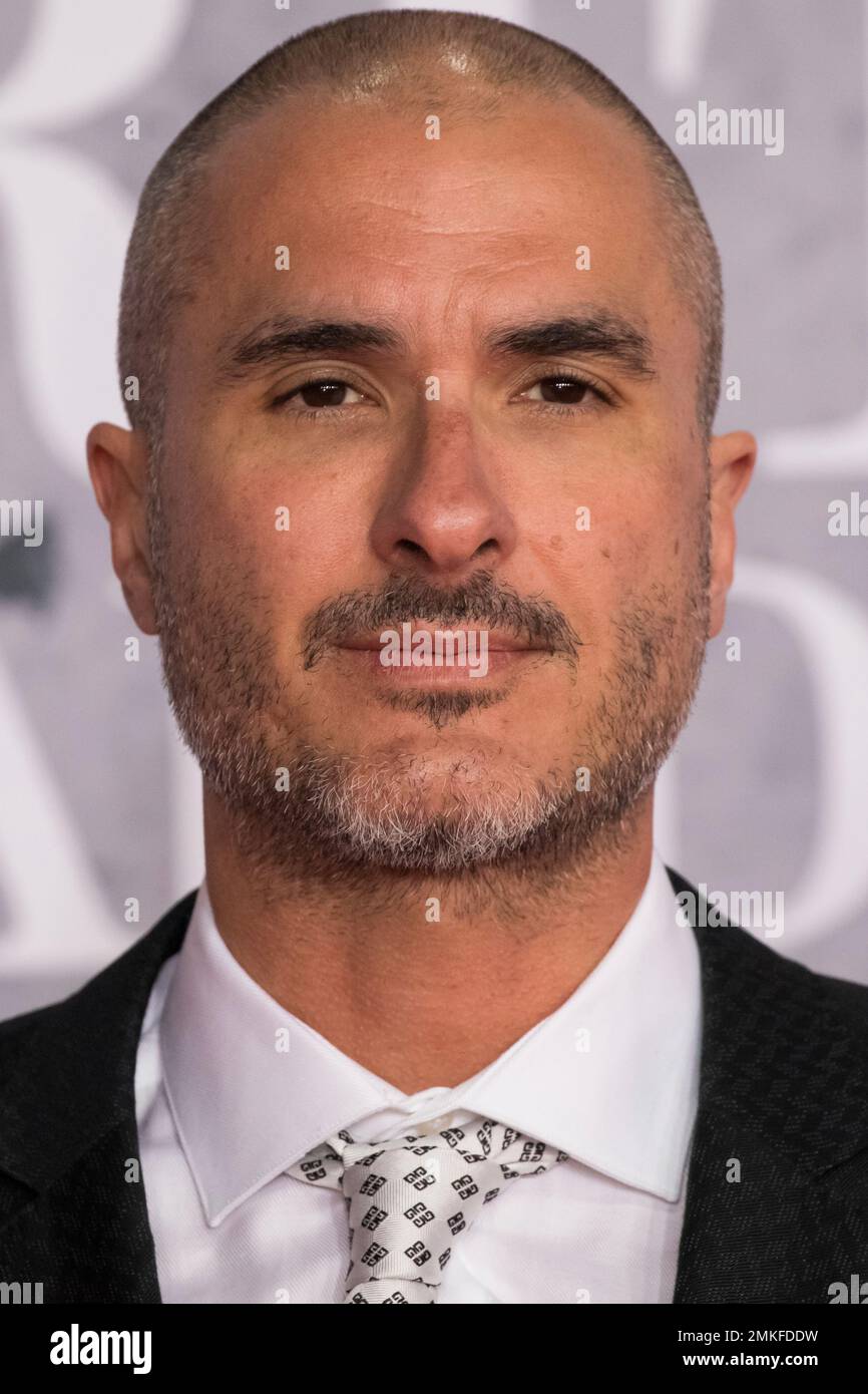 Zane Lowe poses for photographers upon arrival at the Brit Awards in