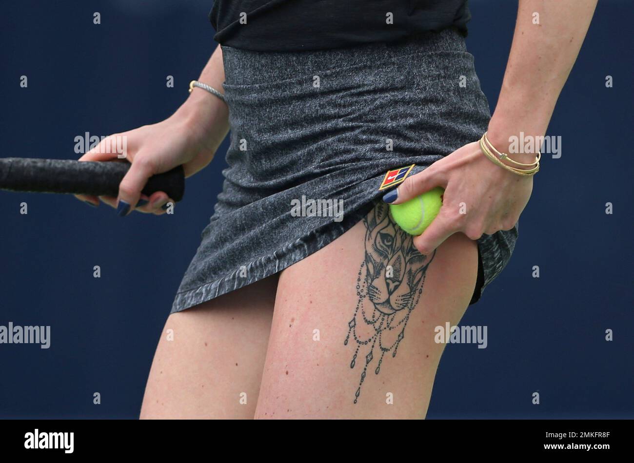Ukraine's Elina Svitolina tattoo is shown as she prepares to serve against  Ons Jabeur of Tunisia during a match of the Dubai Duty Free Tennis  Championship in Dubai, United Arab Emirates, Tuesday,, image size:1300x950