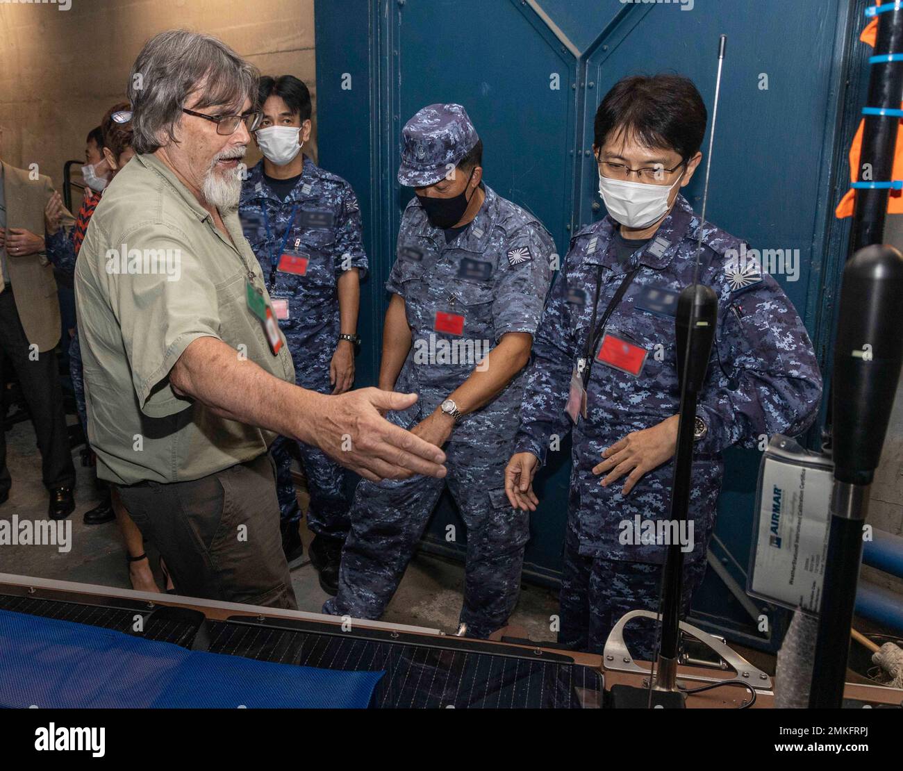 220908-N-FO714-1051  YOKOSUKA, Japan (Sept. 8, 2022) Mr. Barry Parker, Trident Research Secure Autonomous Datalink for Undersea Warfare (USW) Portable Range (SADL-UP) lead engineer, conducts familiarization training for Japan Maritime Self-Defense Force (JMSDF) sailors for an upcoming anti-submarine warfare bilateral training exercise at the Commander, Task Force 71 cave onboard Commander, Fleet Activities Yokosuka, Sept. 8. The U.S. Navy and JMSDF regularly fly, sail and operate together with other Allies and partners to promote security and stability throughout the region. Stock Photo