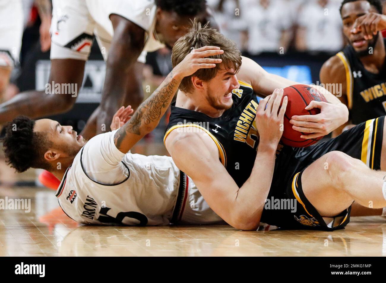 Wichita State's Asbjorn Midtgaard, right, and Cincinnati's Cane Broome