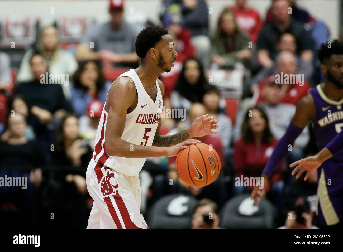 Washington State forward Marvin Cannon (5) dribbles the ball during the  second half of an NCAA college basketball game against Washington in  Pullman, Wash., Saturday, Feb. 16, 2019. (AP Photo/Young Kwak Stock