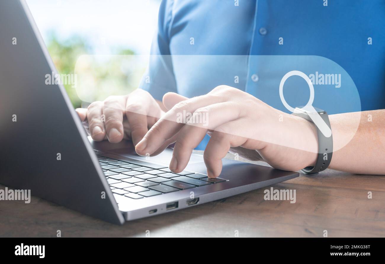 Man using laptop with internet browser search bar. SEO Search engine optimization, Search technology. Using websites search bar to find desired inform Stock Photo