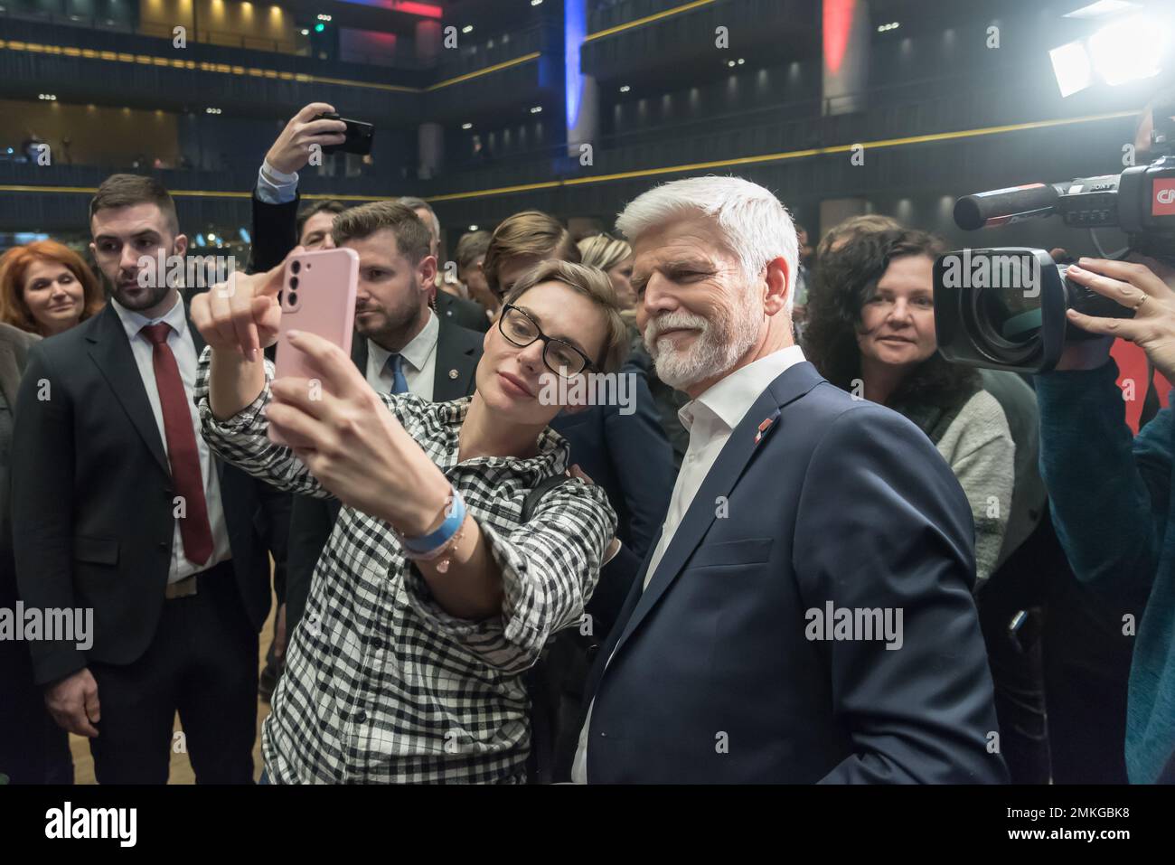Prague, Czech Republic. 28th Jan, 2023. A supporter seen taking selfies using a mobile phone together with winner of Czech presidential elections Petr Pavel, (R) at his campaign headquarter in Prague. Petr Pavel wins the presidential elections, outpacing former Czech prime minister, chairman of political movement ANO and billionaire Andrej Babis. (Photo by Tomas Tkacik/SOPA Images/Sipa USA) Credit: Sipa USA/Alamy Live News Stock Photo