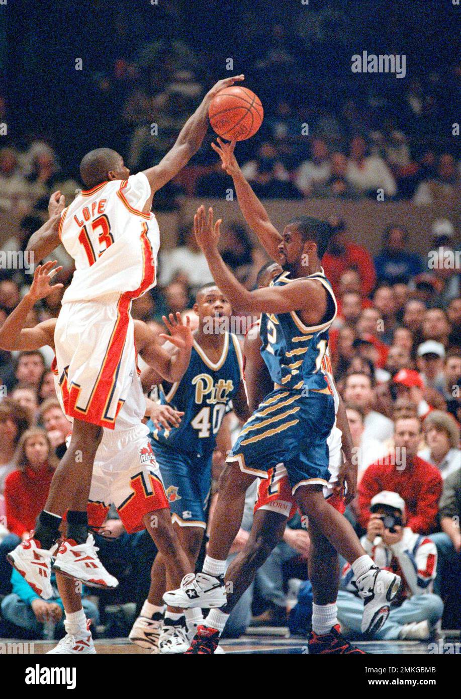 St. John's freshman guard Felipe Lopez, left, tries to block