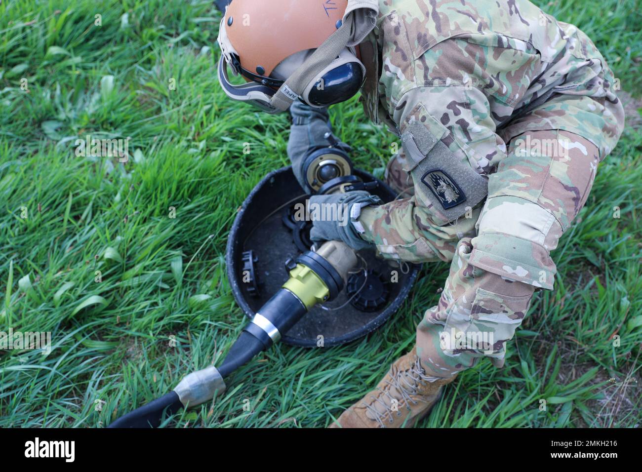 An Army Petroleum Supply Specialist under the 12th Combat Aviation Brigade connects a fuel hose
