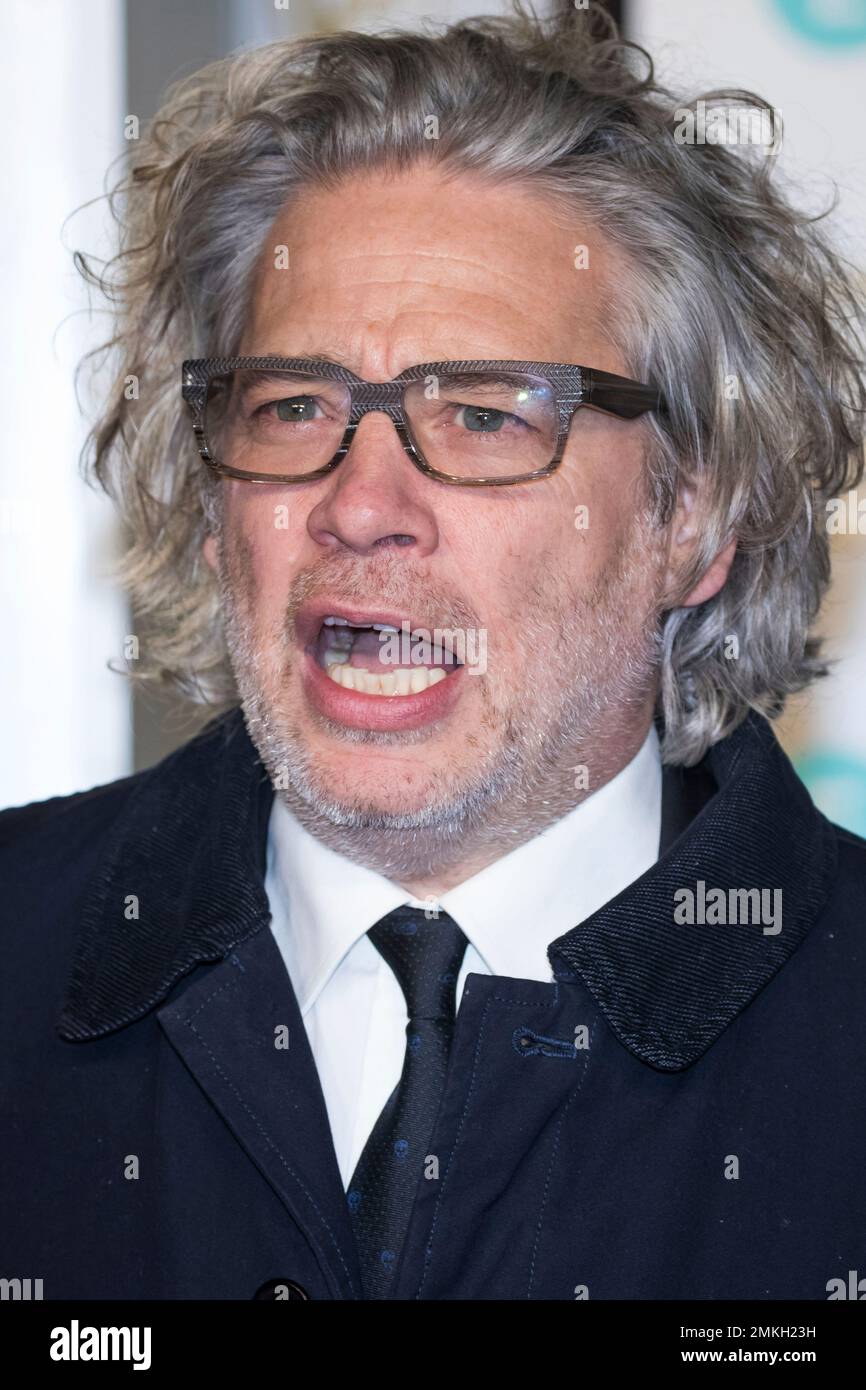 Dexter Fletcher poses for photographers upon arrival at the BAFTA Film