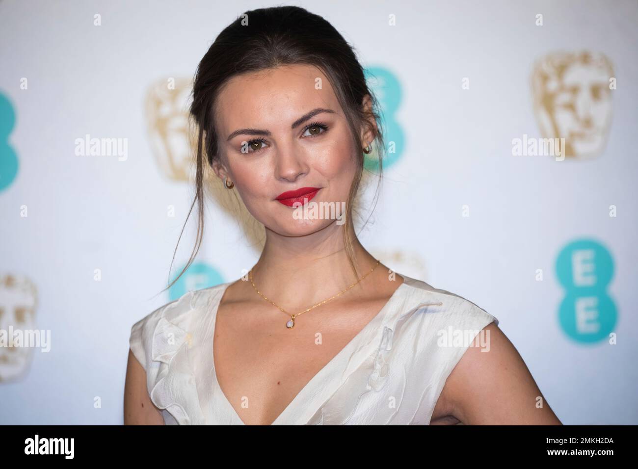 Niomi Smart poses for photographers upon arrival at the BAFTA Film
