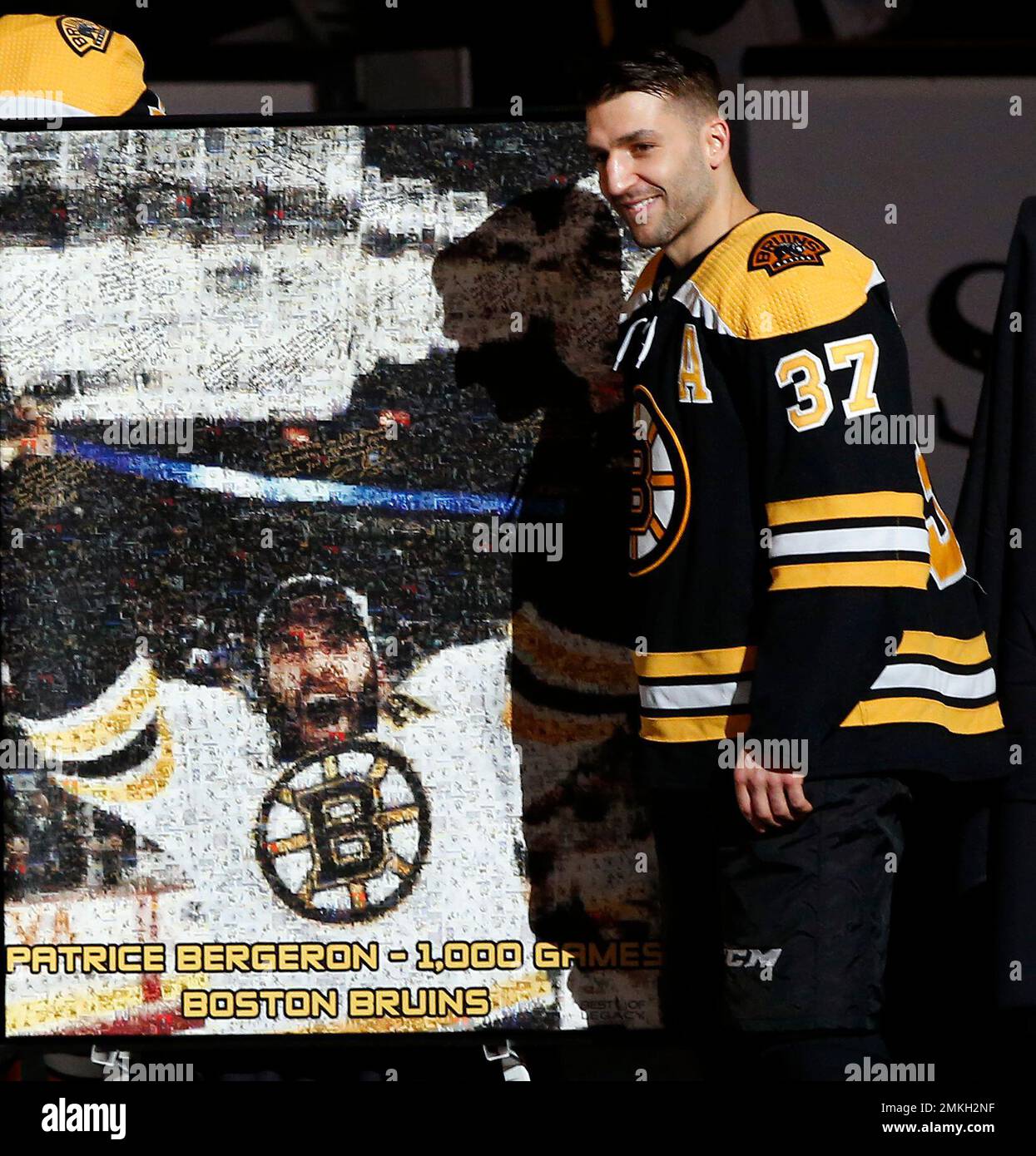 Patrice Bergeron Boston Bruins Unsigned 2011 Stanley Cup Champions Raising  Cup Photograph