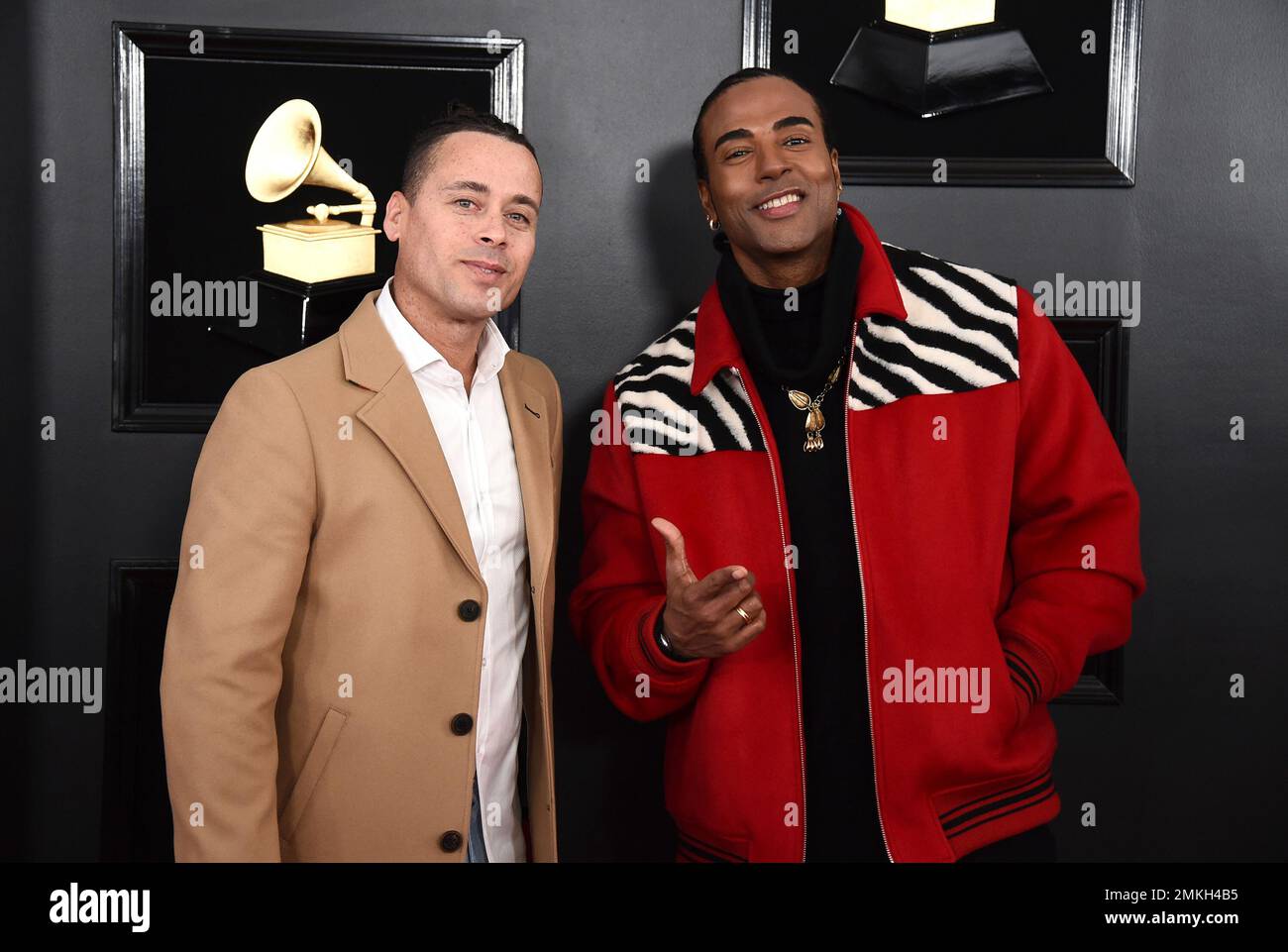 Ruzzo Medina, left, and Yotuel Romero, of Orishas, arrive at the 61st