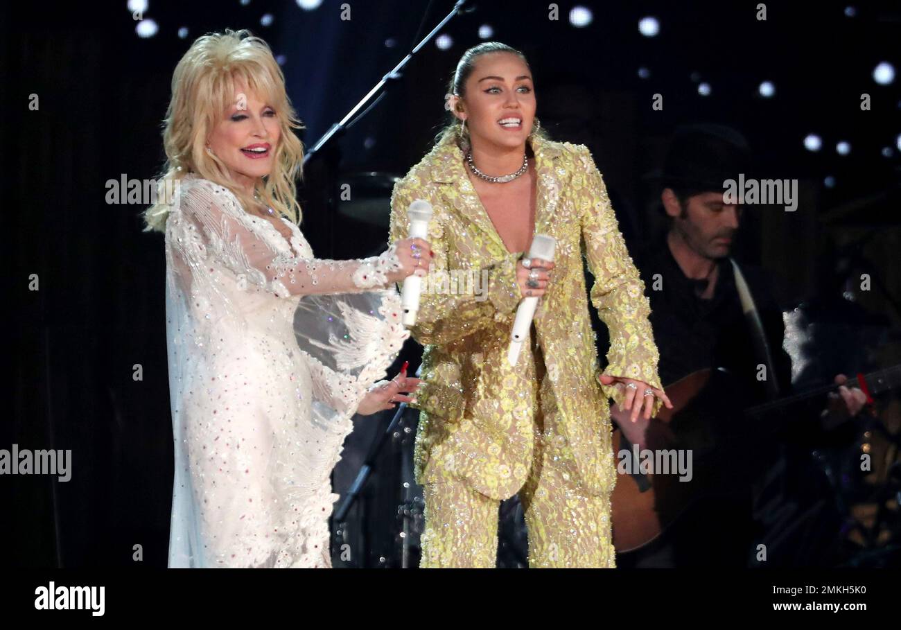 Dolly Parton, left, and Miley Cyrus perform "Jolene" at the 61st annual