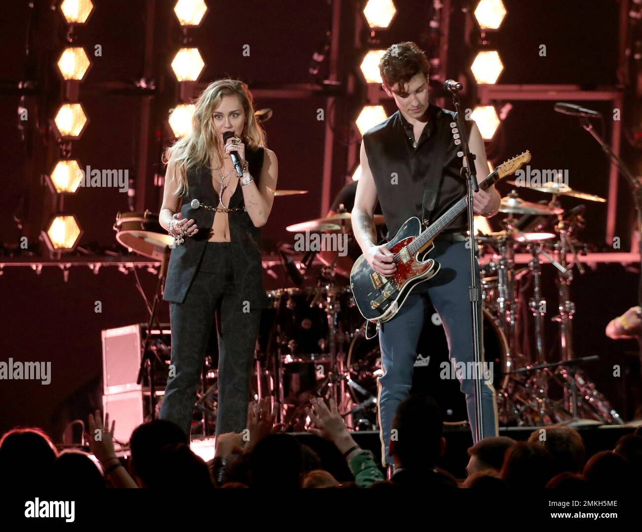 Miley Cyrus, left, and Shawn Mendes perform "In My Blood" at the 61st