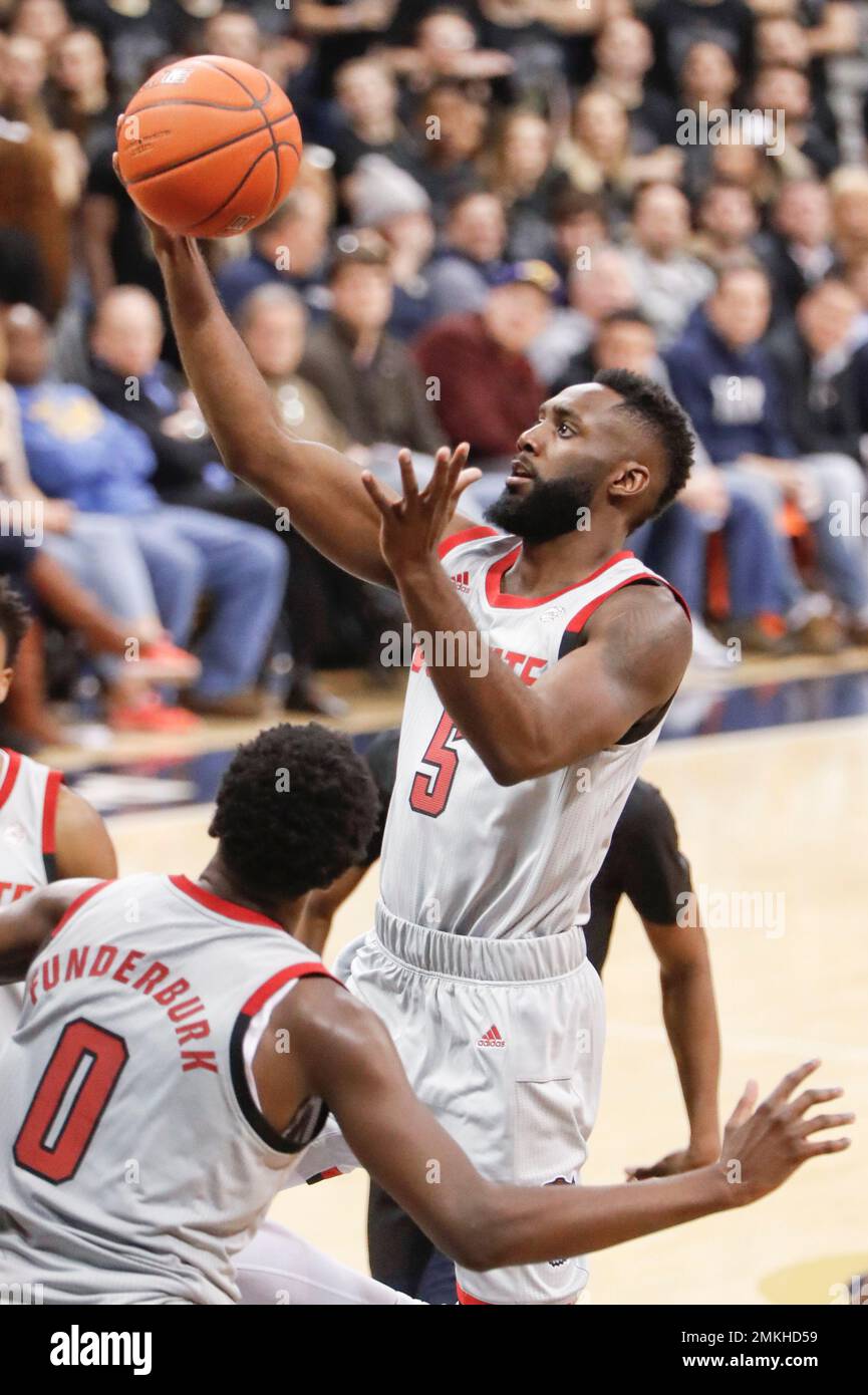 North Carolina State's Eric Lockett (5) plays against Pittsburgh's in an NCAA college basketball game, Saturday, Feb. 9, 2019, in Pittsburgh. (AP Photo/Keith Srakocic) Stock Photo