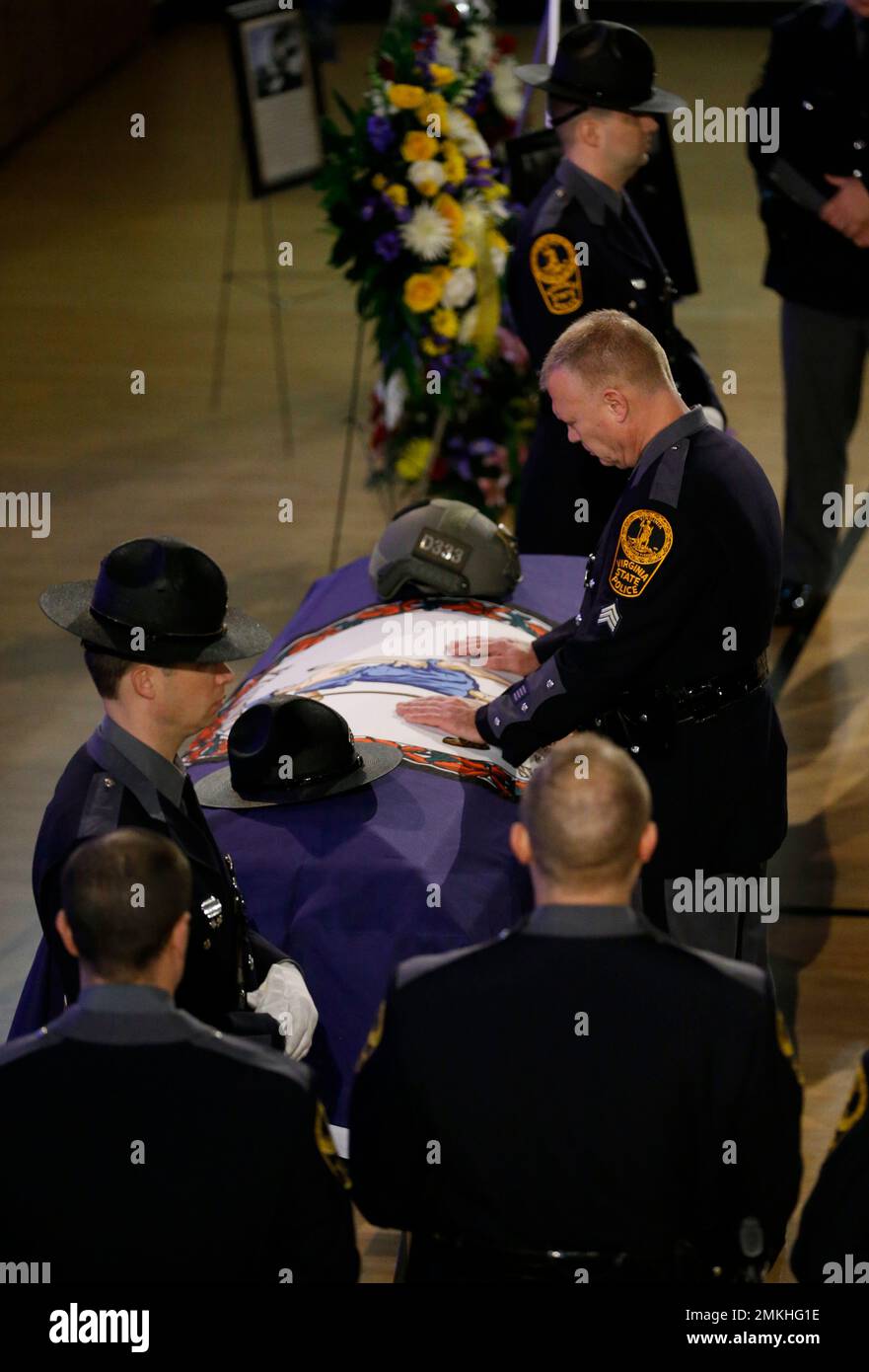 Virginia State troopers shed tears as they pay their respects prior to