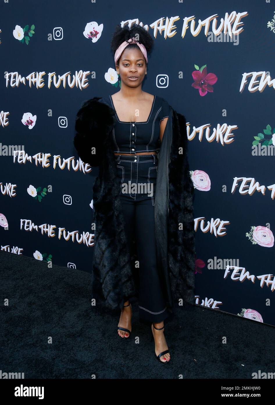 Singer Ari Lennox poses at the 