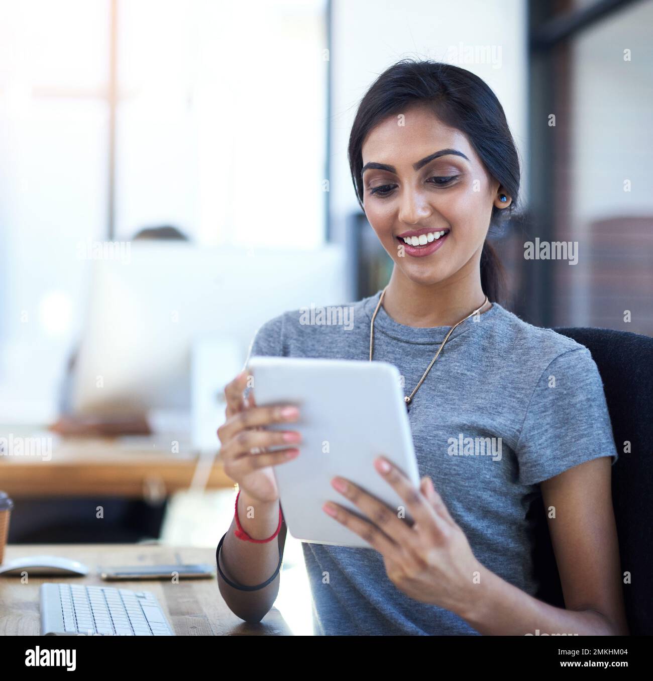 Every app you could think of to get work done. a young businesswoman ...