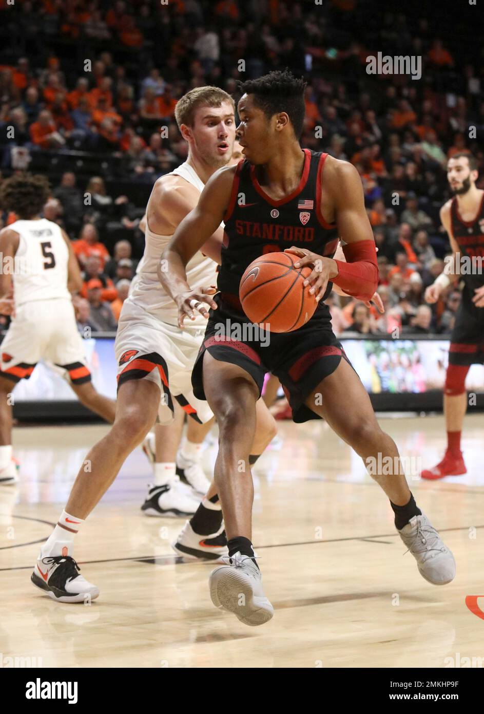 Stanford's KZ Okpala (0) pivots past Oregon State's Tres Tinkle during
