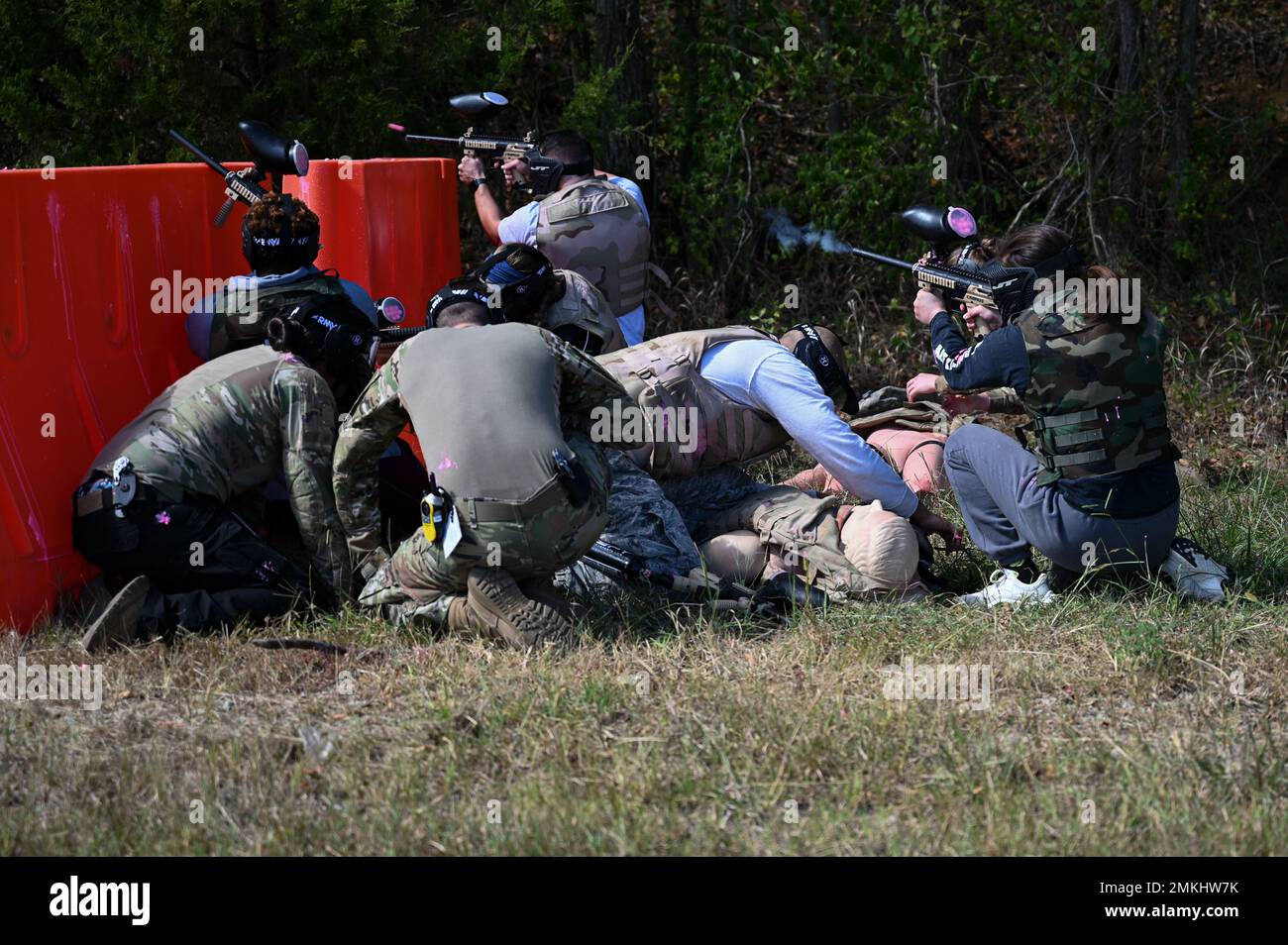 U.S. Air Force Airmen assigned to the 633d Medical Group fire paintball